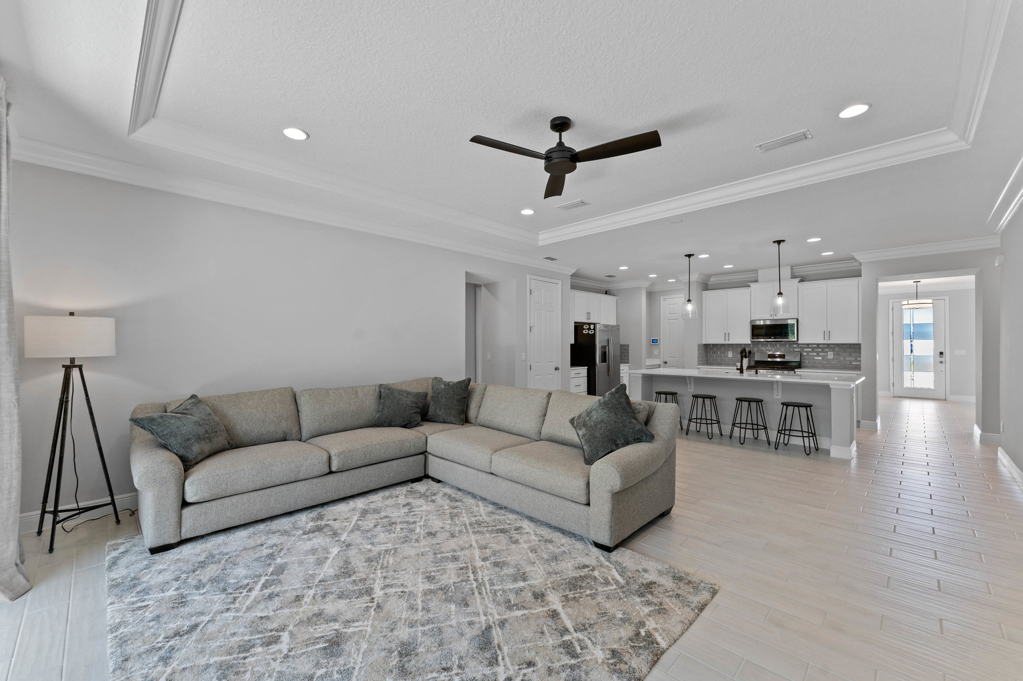 living room and kitchen with open concept floor plan and white walls